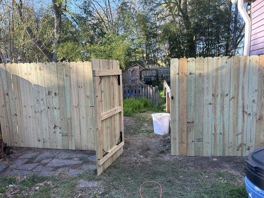 Perimeter fence with multiple gates by Roar Construction