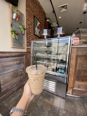 Iced Hazelnut Cappuccino sitting inside