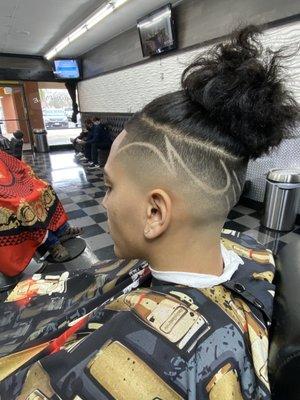 Skin fade with a design.