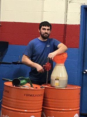 CJ, happily pumping fresh oil. Always smiling. ;)