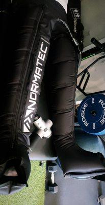 One of our recovery tools, the normatec recovery leg sleeve & the hyper volt percussion massage gun.