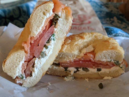 Asiago bagel with Scallion Herb Cream Cheese, Capers, sliced Tomato, and Lox.