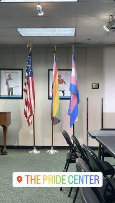 Standing proud. Right next to the American flag stands the Progress and Trans flags