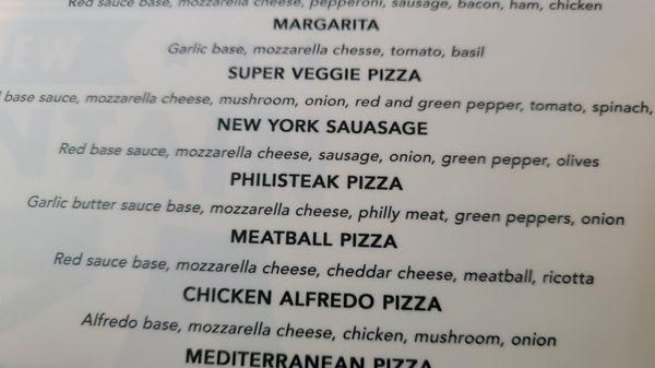 Close up of some pizza items on the menu