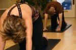 Cat Stretch in a Pilates Mat Class