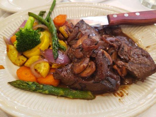 Beef Medallions in mushroom wine butter sauce and grilled veggies