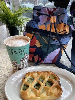 Chai latte with oat milk and spinach bread.