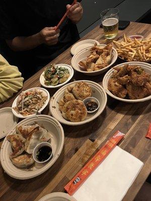 Dumplings, fried chicken, chicken salad, cucumber salad, and fries