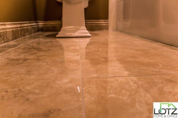 New tile installation. Notice the tiled air duct on the floor and the tiled baseboard.  http://www.lotzremodeling.com