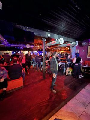 Inside main floor in front of stage and dance floor