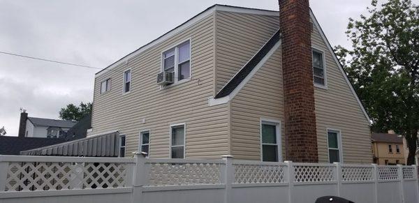 Back and side view of house. Siding is very neat!