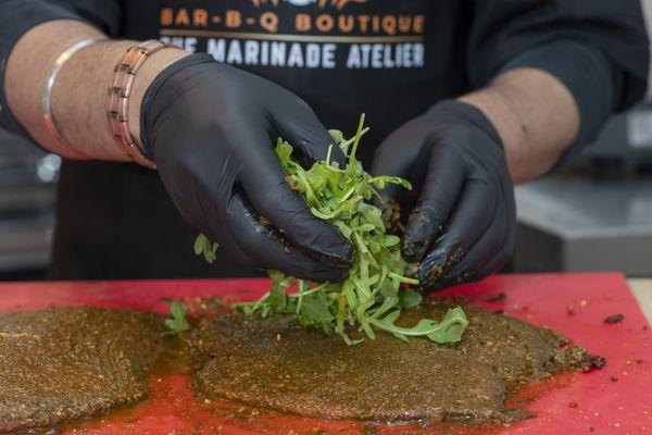 Provolone blueberry arugula pinwheel preparation in progress