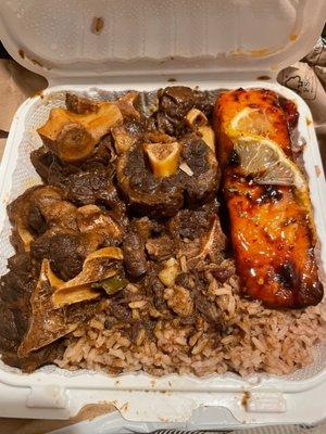 Oxtail with rice and peas and jerk salmon. 10/10 GO GET SOME!!!