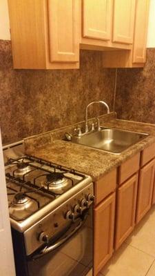 Added kitchen backsplash and new flooring! Excited to cook in this new kitchen