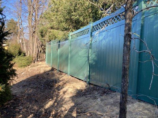 Green solid vinyl fence