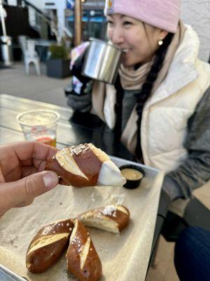 Pretzel dipped in cheese