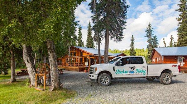 The Alaskan Fishing Adventures Truck parked outside Anglers lodge on a gorgeous day in Alaska.