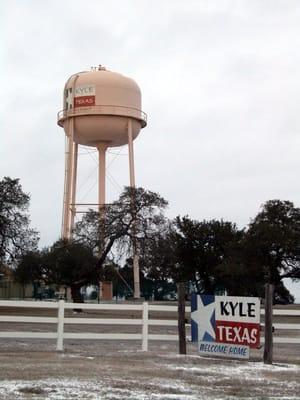 Water tower and Kyle sign at SE Corner of Plum Creek