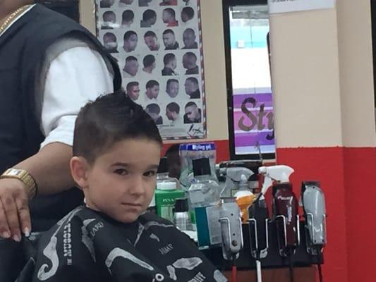 Ben getting his hair cut with angel