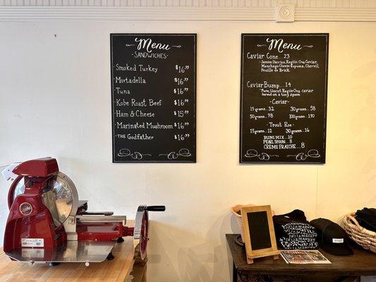 Counter with meat slicer and menu