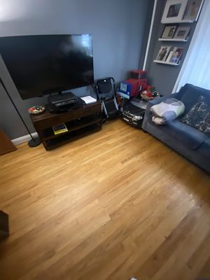 Wood floors cleaned and tv stand clean