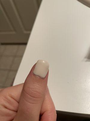 Dip powder is sitting horribly on the nail, you can actually see it at the bottom like a lump