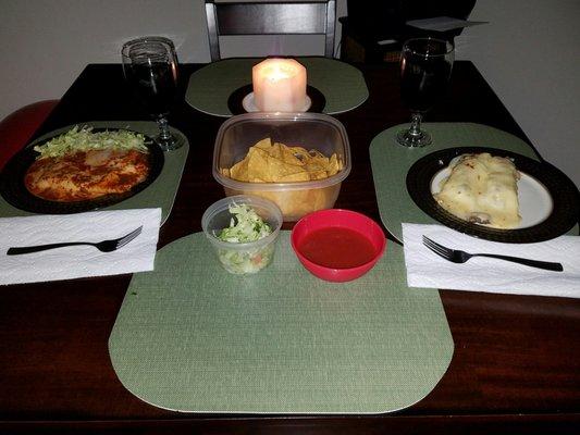 Last minute take-out dinner...Beef burritos w/extra melted cheese & salsa,Steak burritos w/extra queso! Side lettuce, Chips/Salsa.