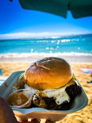 Waikiki beach smashing a burger