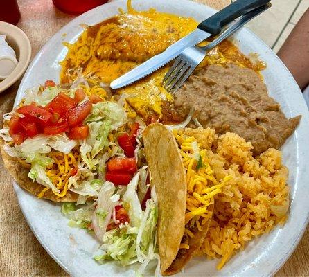 One of the TexMex dinner plates with cheese enchilada, crispy beef taco, and tostada