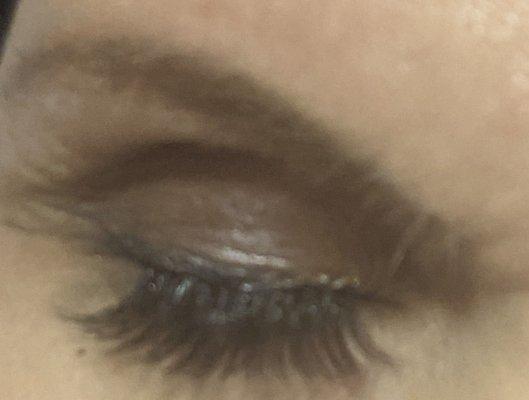 Lashes applied unevenly and gaps at corners