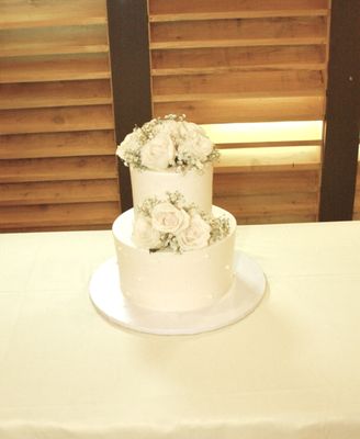 2 tier dulce de leche white cake with fresh flowers