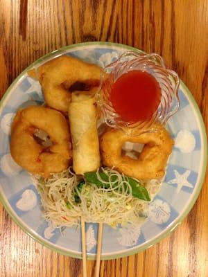 Food from Golden China taken back home.  Those ' donuts' are sweet and sour shrimp.