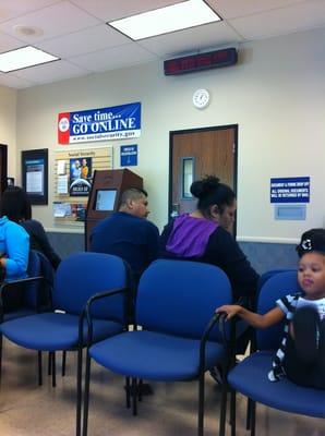 Waiting area (Check-In/Registration monitor under sign)