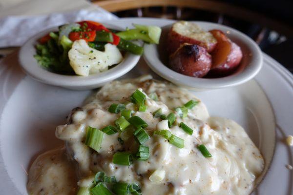 Chicken Chesapeake - Grilled chicken breasts topped with lump crab meat and Old Bay in a cream sauce topped with scallions.