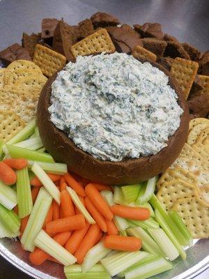 Spinach dip bread bowl with carrots , celery , crackers and chunks of bread! Call need an event catered?   920-457-3034, ask for Walter