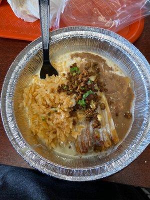 Tamales with Mexican sausage, rice and refried beans.