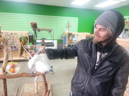 Cody with a friendly cockatoo