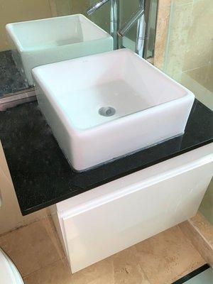 Wall hung vanity with square vessel sink