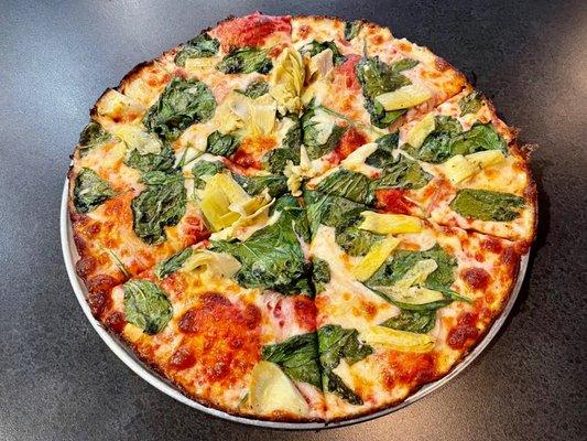 "The Stooges" bar style pizza with artichoke hearts, spinach, mozzarella, and Parmesan. Why The Stooges? Maybe Iggy Pop approves!