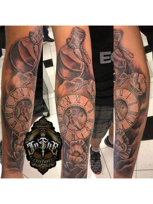 Lotus flowers & Clock with gears tattoo by Josue T , Addictive Ink Tattoo Studio.