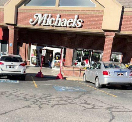 Less then adequate handicap parking spaces, w/ one . turned into online/store pick spaces