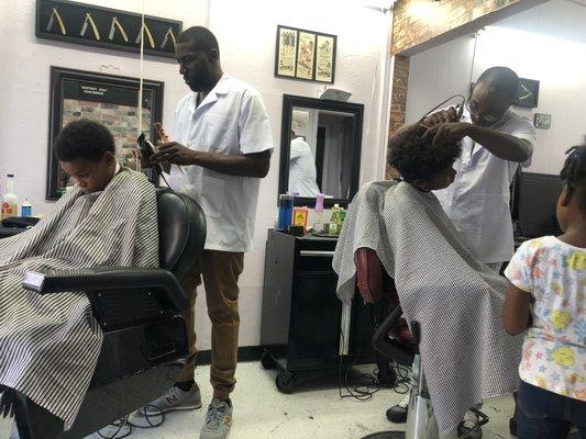 Professionally dressed barbers