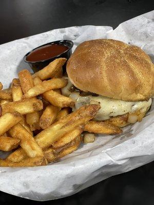 Mushroom Swiss burger with coated fries.