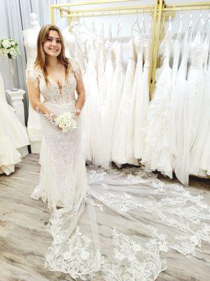 Elegant White Beaded Floral Lace Applique Mermaid Wedding Dress With Long Sleeves | Available to try exclusively in our boutique.