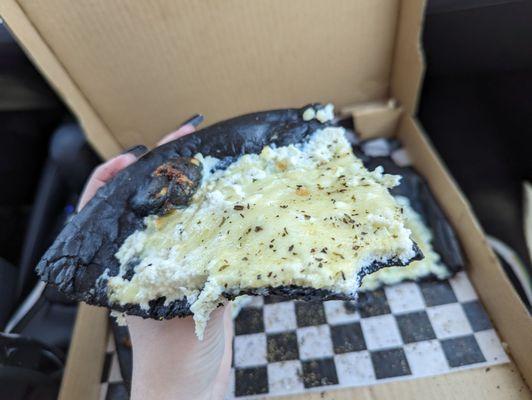 A slice of the 'White Witch' black-crusted pizza