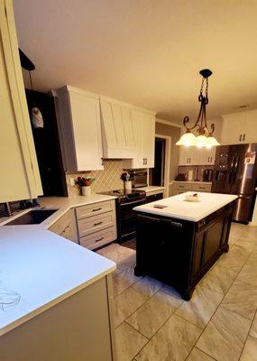 Beautiful custom hood, tile floor, and cabinets that go to the ceiling!