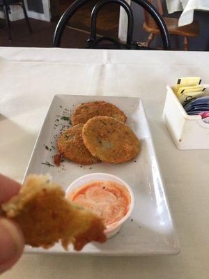 Fried green tomatoes with a homemade sauce.