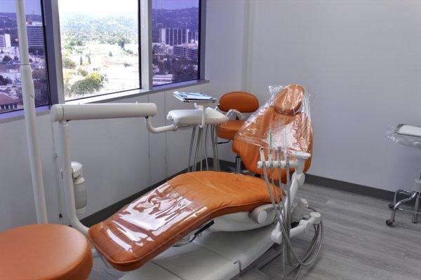 As you recline in the dental chair, you can take in the hustle and bustle of the city below, providing a calming distraction.