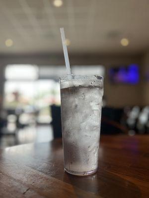 Shimmering glass of water with lemon