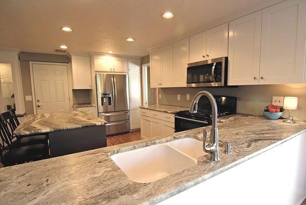 Dreamy Fantasy Brown Marble is a show stopper in this kitchen!  Contact us today to start designing your own kitchen update! . 503-691-1628